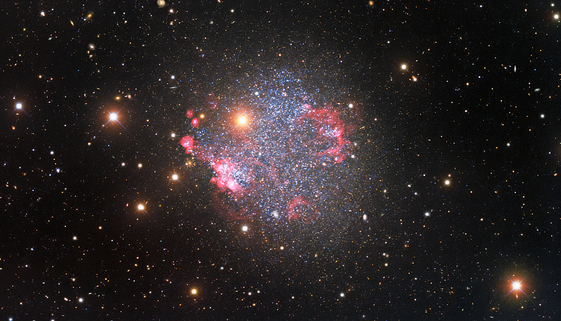 A glittering image of irregular dwarf galaxy Sextans A captured by the Nicholas U. Mayall 4-meter Telescope at Kitt Peak National Observatory courtesy of KPNO/NOIRLab/NSF/AURA.