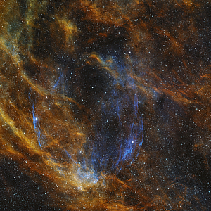 An image of the blue glowing halo of supernova remnant W63 (SNR G82.2+5.3) in Cygnus courtesy of Manuel Peitsch.